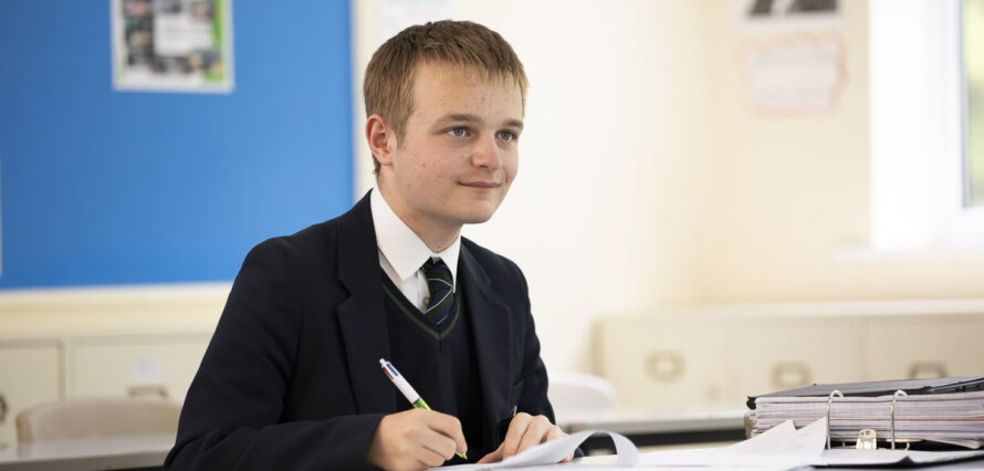 Boy studying in classroom